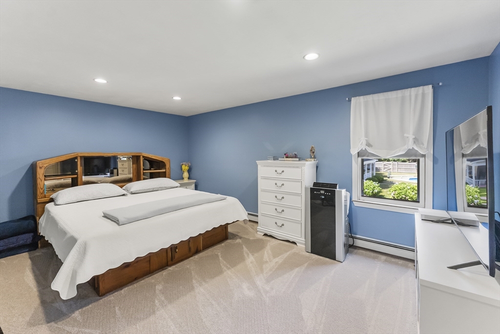 67 Roxy Cahoon Road Plymouth, MA 02360 - Photo 15 of 37 a bedroom with a bed and a large window