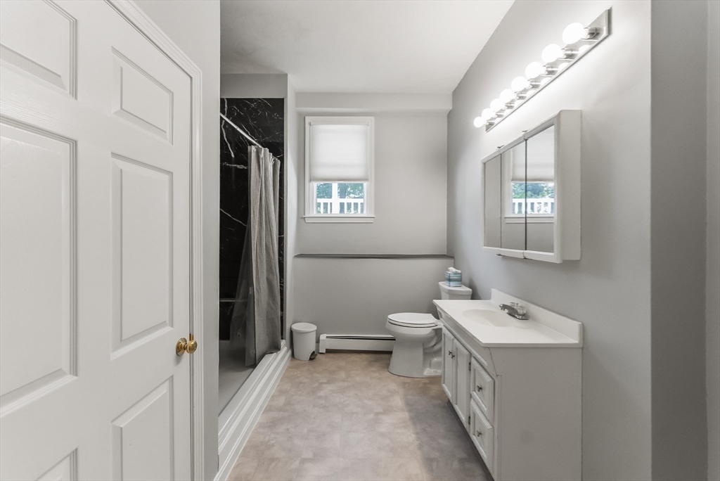 67 Roxy Cahoon Road Plymouth, MA 02360 - Photo 24 of 37 a bathroom with a sink a toilet and a mirror