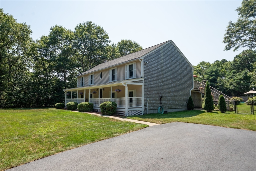 67 Roxy Cahoon Road Plymouth, MA 02360 - Photo 27 of 37 a view of a house with a yard and large trees
