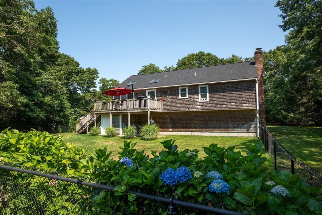 67 Roxy Cahoon Road Plymouth, MA 02360 - Photo 5 of 37 front view of a house with a yard