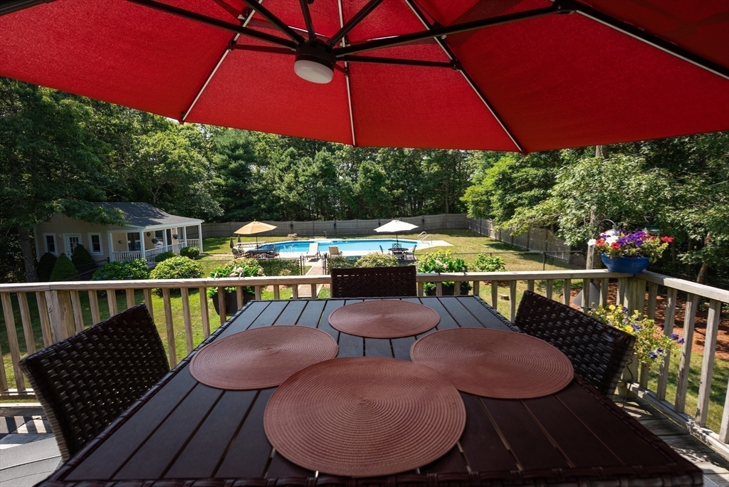 67 Roxy Cahoon Road Plymouth, MA 02360 - Photo 6 of 37 a view of a balcony with furniture and outdoor view