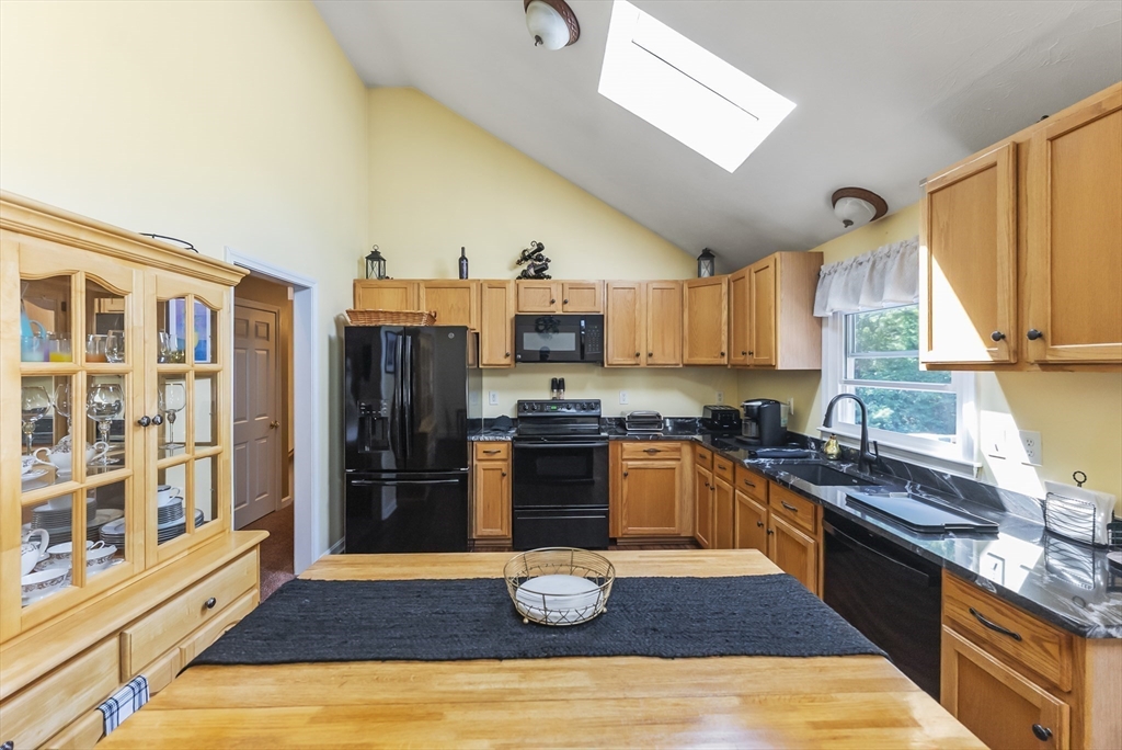 67 Roxy Cahoon Road Plymouth, MA 02360 - Photo 7 of 37 a kitchen with stainless steel appliances granite countertop a refrigerator and a stove top oven