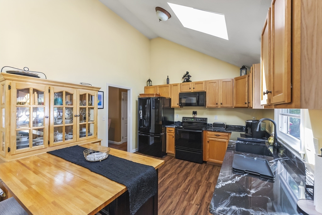 67 Roxy Cahoon Road Plymouth, MA 02360 - Photo 9 of 37 a large kitchen with stainless steel appliances granite countertop a stove and a refrigerator