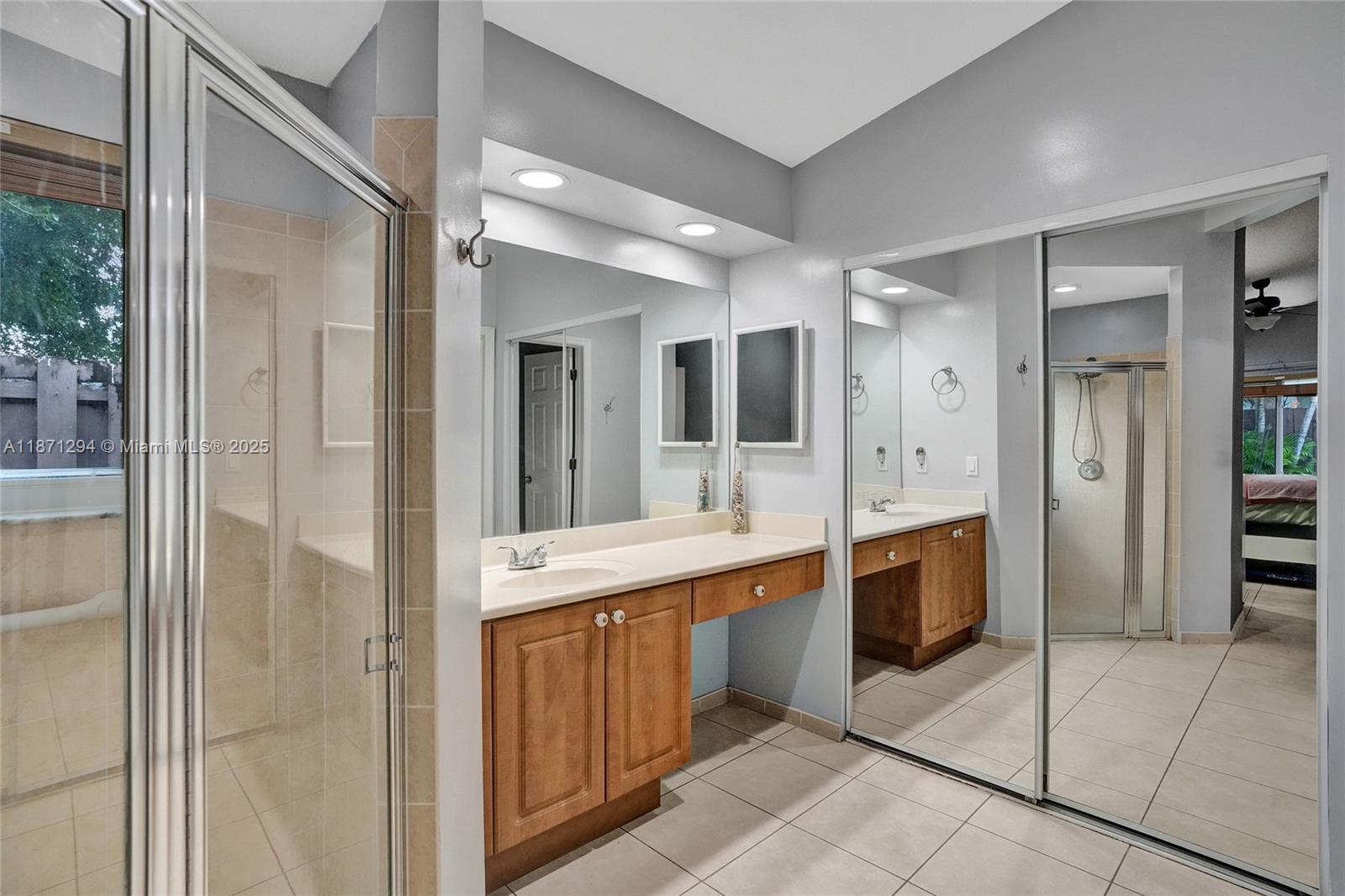 1635 Southeast 20th Place Homestead, FL 33035 - Photo 17 of 19 a large bathroom with a glass shower door a sink and a mirror
