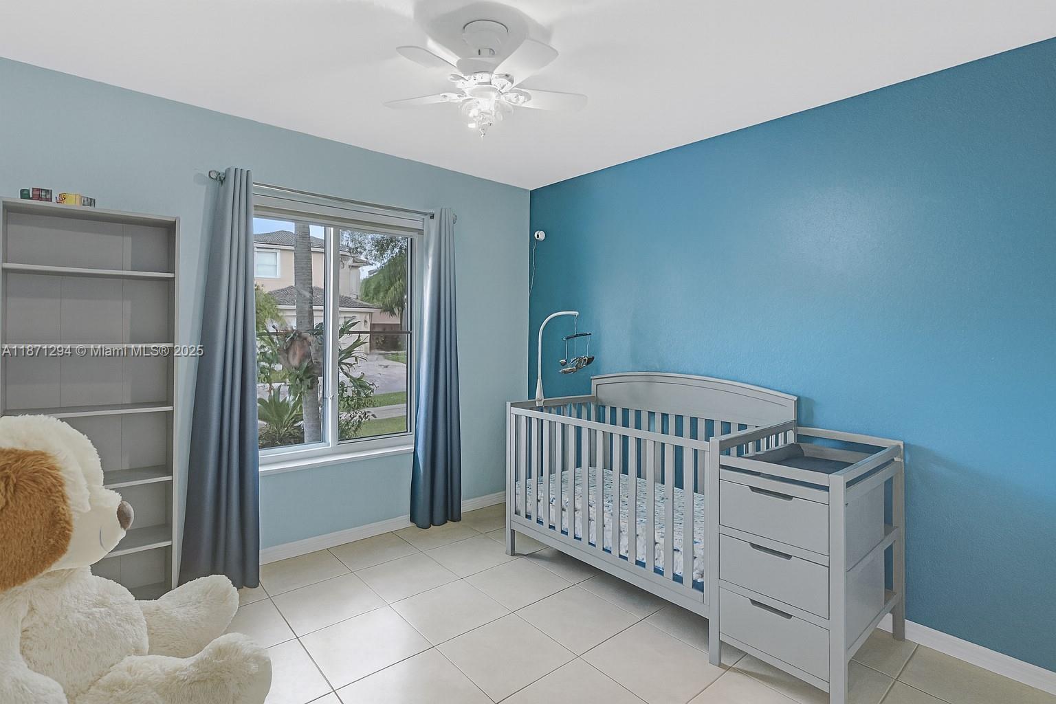1635 Southeast 20th Place Homestead, FL 33035 - Photo 2 of 19 a bedroom with furniture and a window