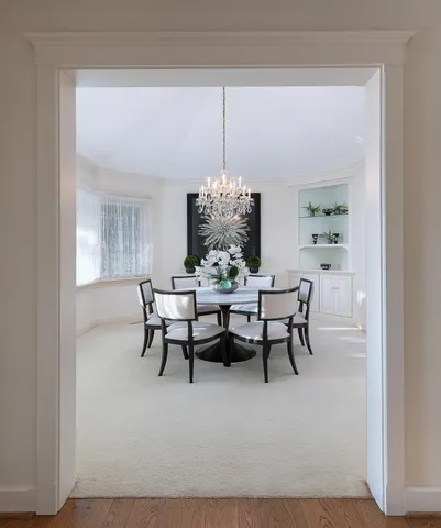 a dining room with furniture and window