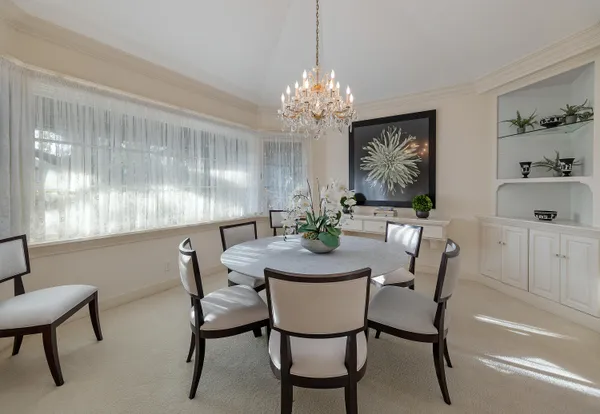a view of a dining room with furniture window and outside view