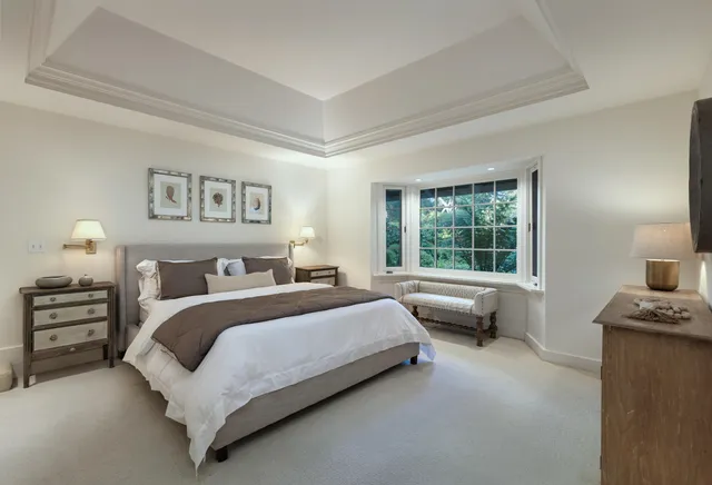 a bedroom with a bed and a couch