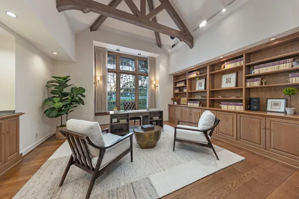 a work room with furniture and a potted plant