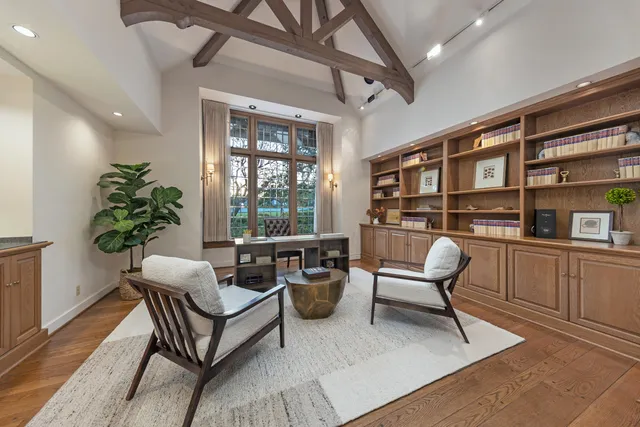 a work room with furniture and a potted plant