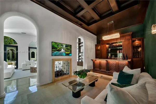 a living room with furniture and a projector