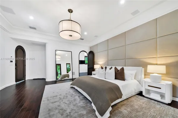 a living room with furniture and a lamp