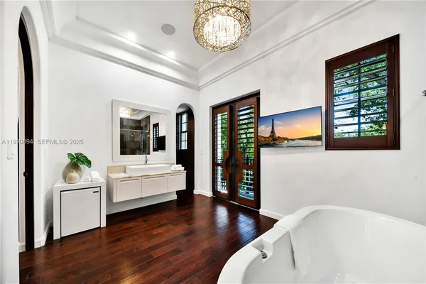 a bathroom with a sink a mirror and a shower