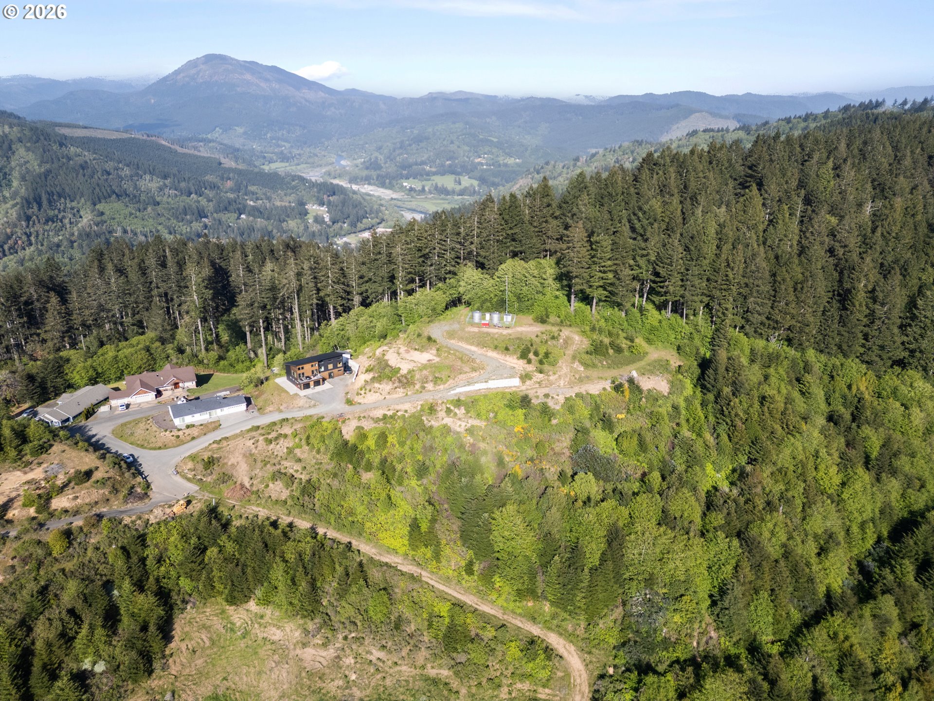 Dale Court, Unit 2 Brookings, OR 97415 - Photo 5 of 13 a view of a house with a mountain