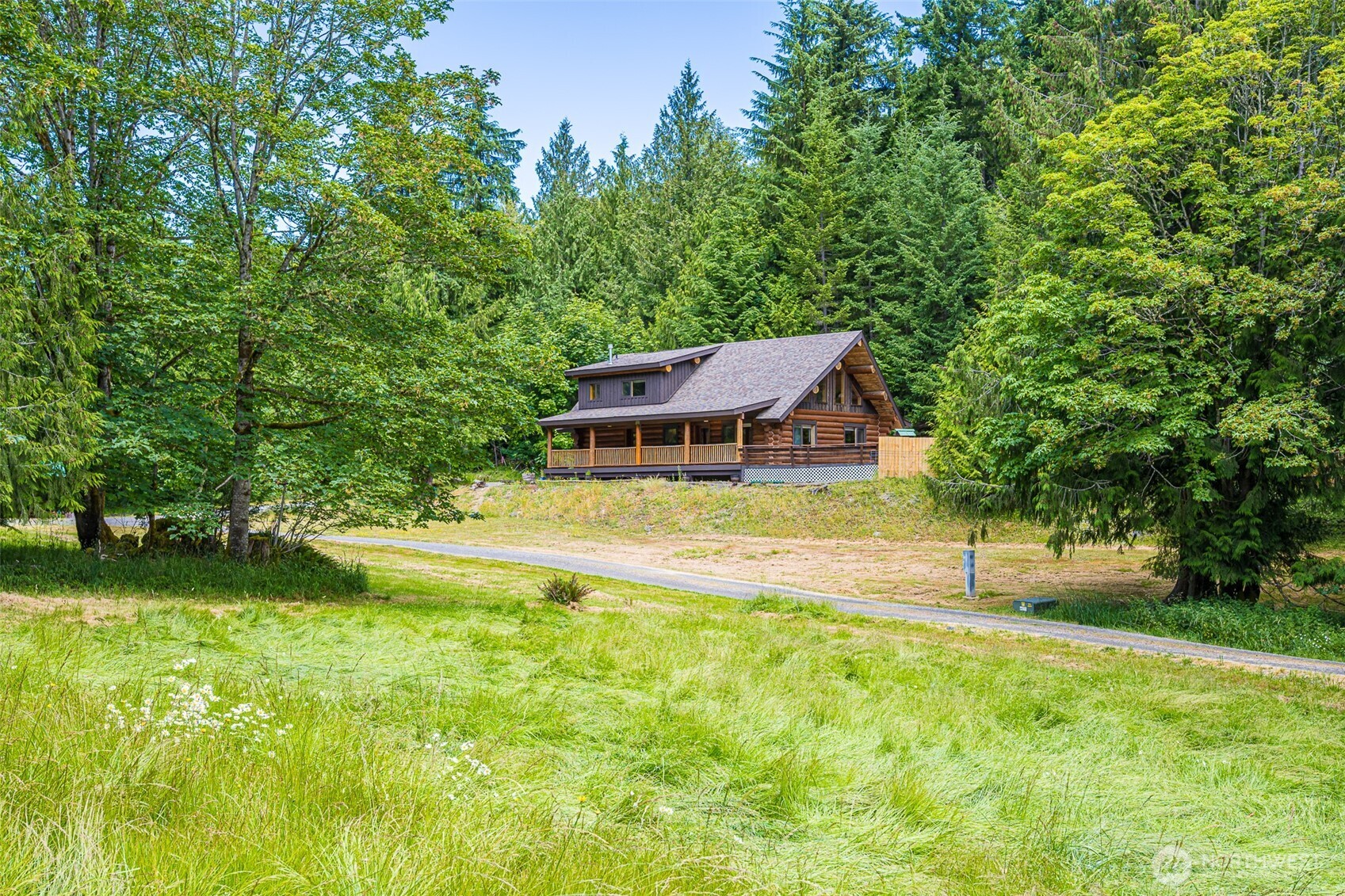 1422 Grauel-Ramapo Road Port Angeles, WA 98363 - Photo 39 of 40 a view of a house with swimming pool