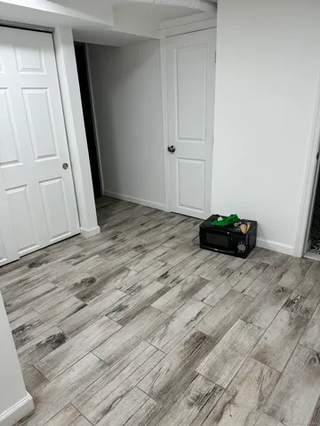 a view of a livingroom with wooden floor