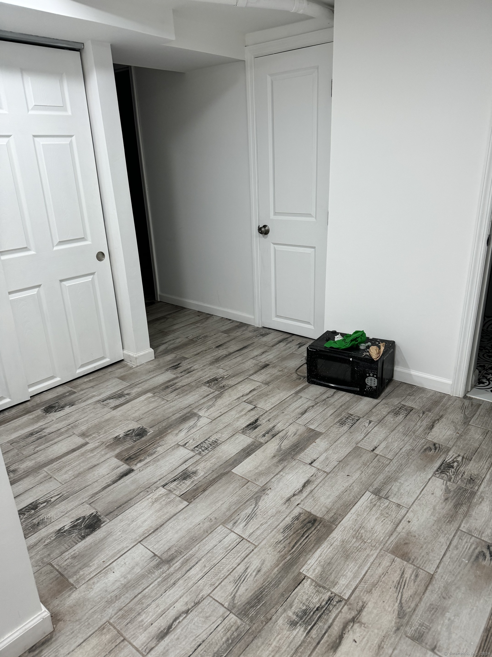 52 Pearl Street, Unit GARDEN New Haven, CT 06511 - Photo 11 of 12 a view of a livingroom with wooden floor