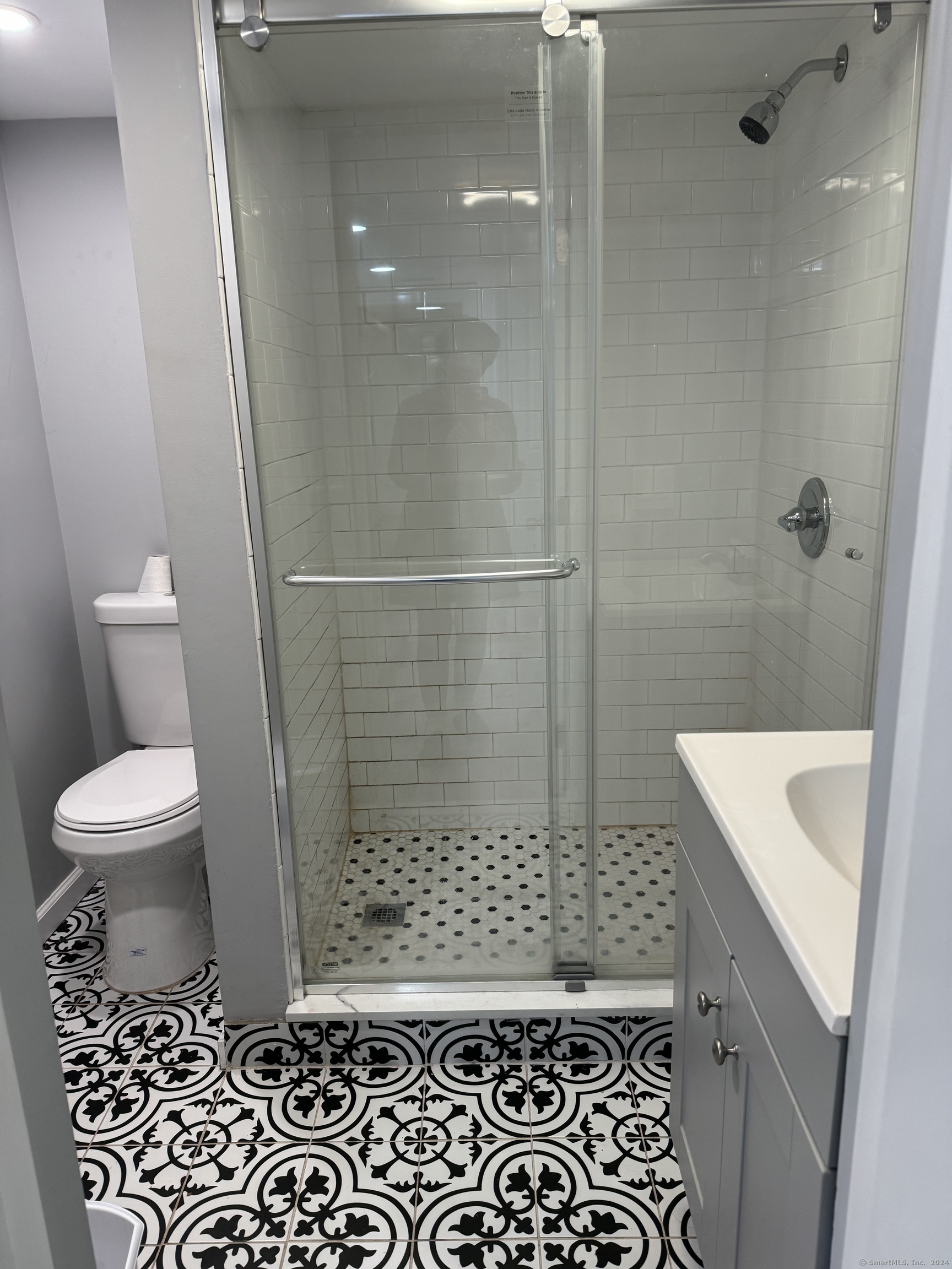 52 Pearl Street, Unit GARDEN New Haven, CT 06511 - Photo 9 of 12 a bathroom with a sink a toilet a window and shower