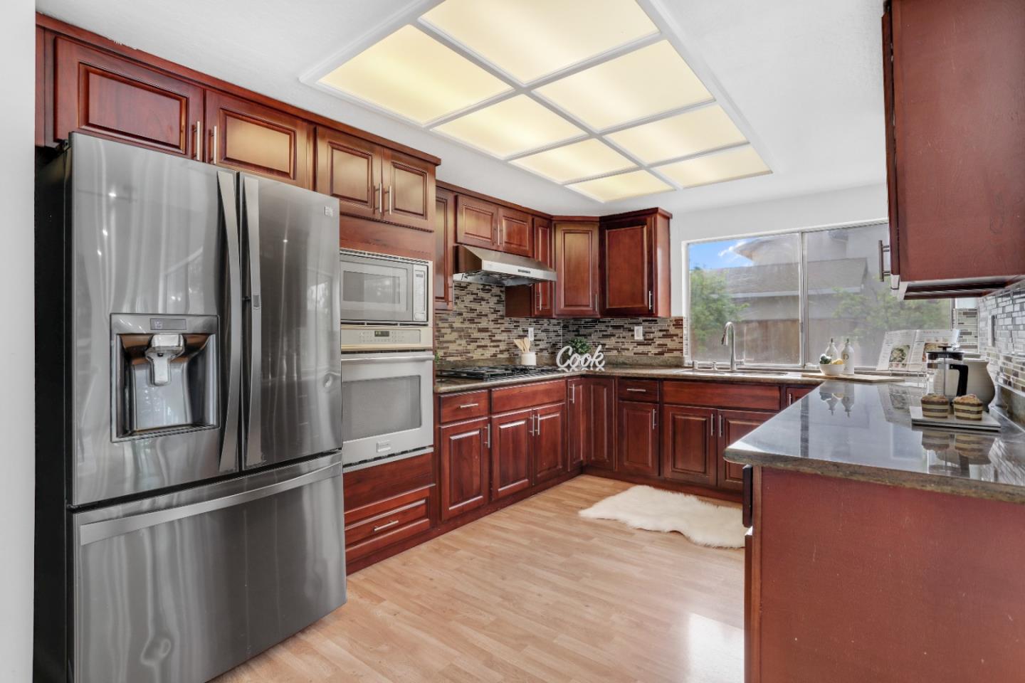 537 Santander Drive San Ramon, CA 94583 - Photo 12 of 28 a kitchen with stainless steel appliances granite countertop a refrigerator and a sink