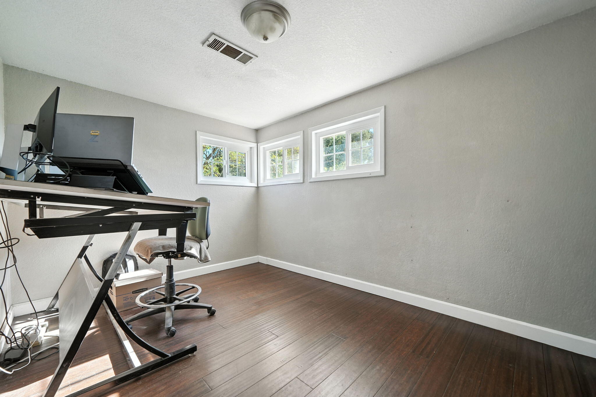22945 Adobe Road Cottonwood, CA 96022 - Photo 13 of 40 a view of a workspace with furniture and wooden floor