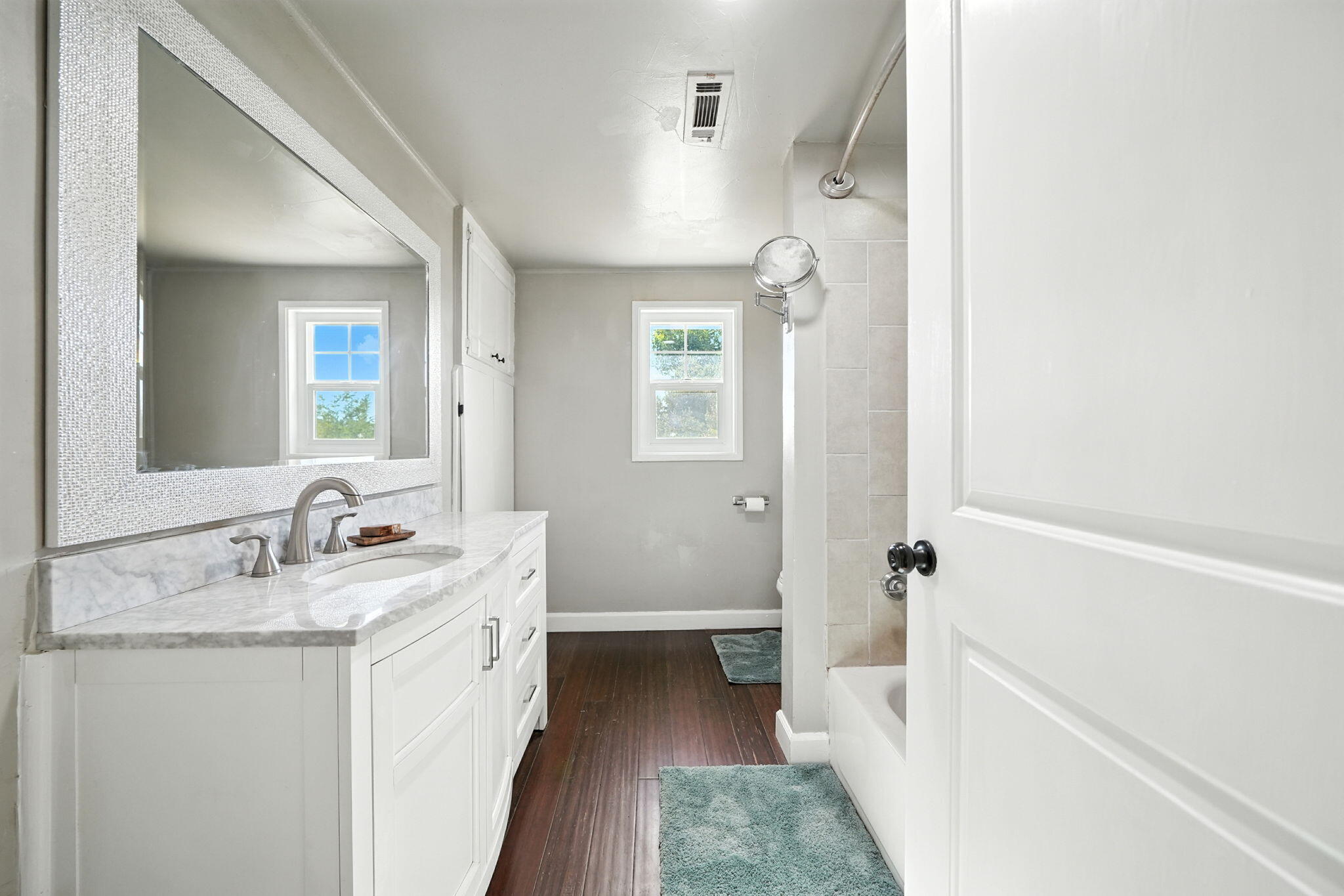 22945 Adobe Road Cottonwood, CA 96022 - Photo 15 of 40 a bathroom with a granite countertop sink a mirror and a bathtub