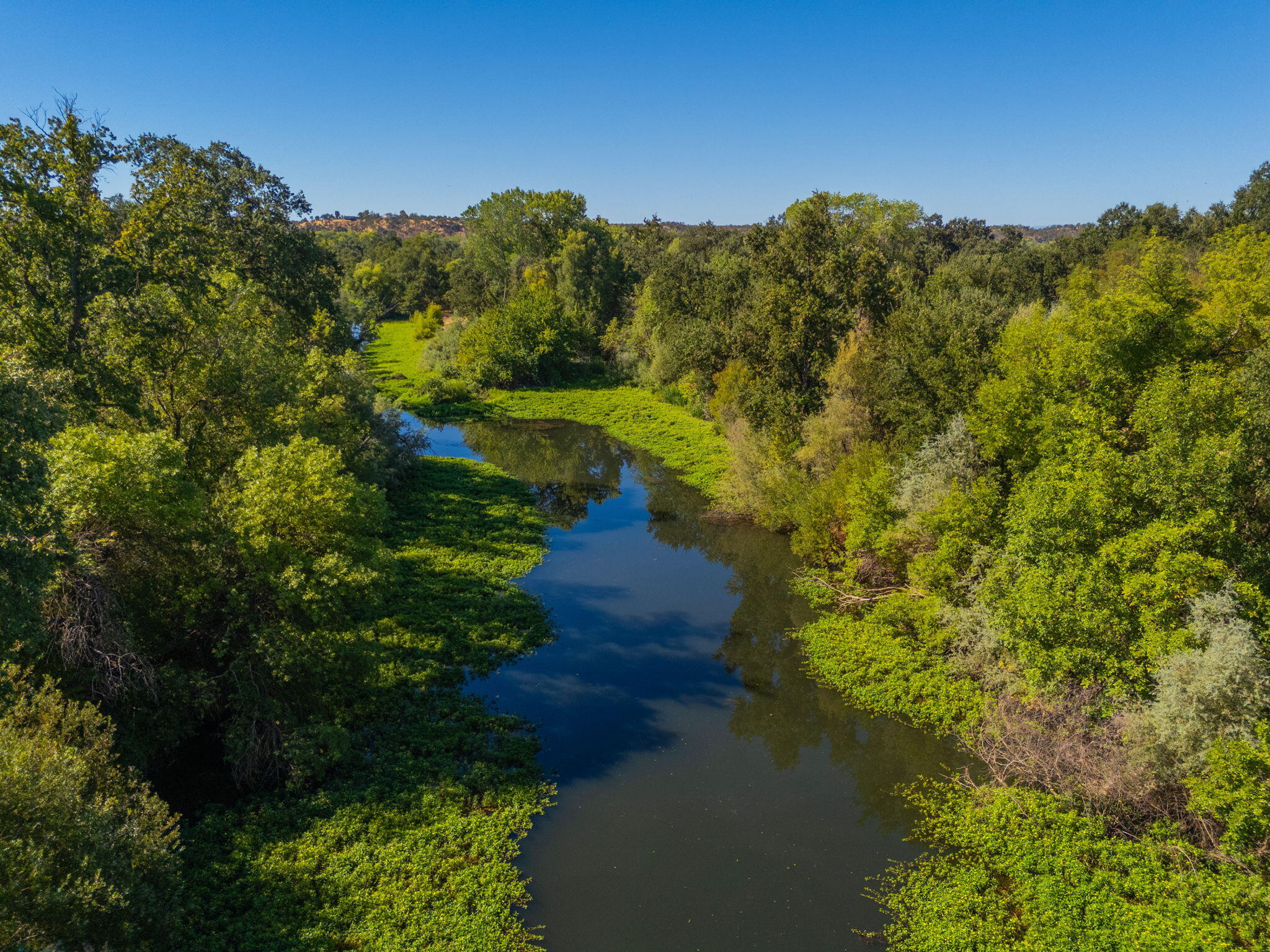 22945 Adobe Road Cottonwood, CA 96022 - Photo 2 of 40 a view of a lake with a mountain