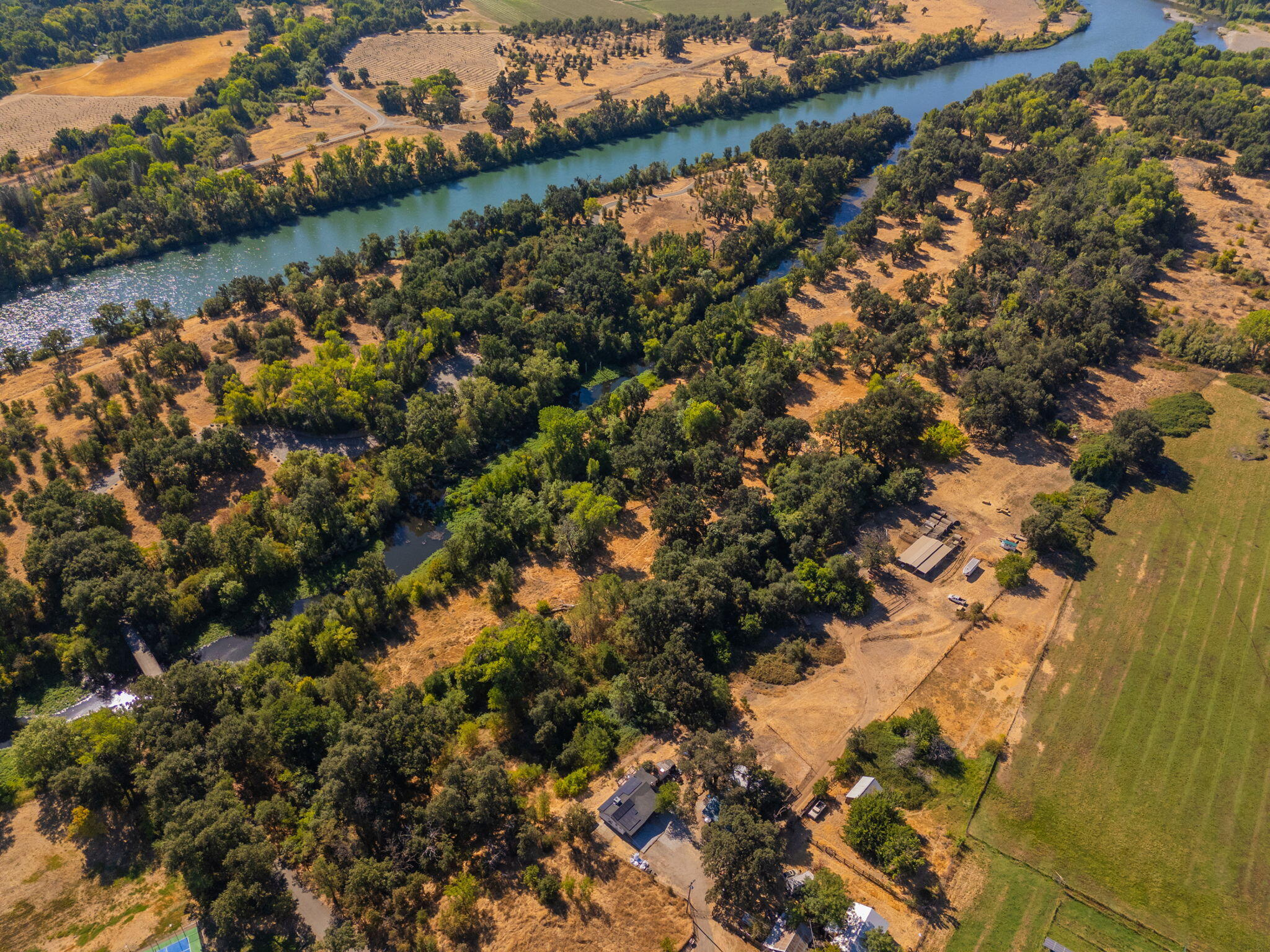 22945 Adobe Road Cottonwood, CA 96022 - Photo 23 of 40 a view of a lake with a tree