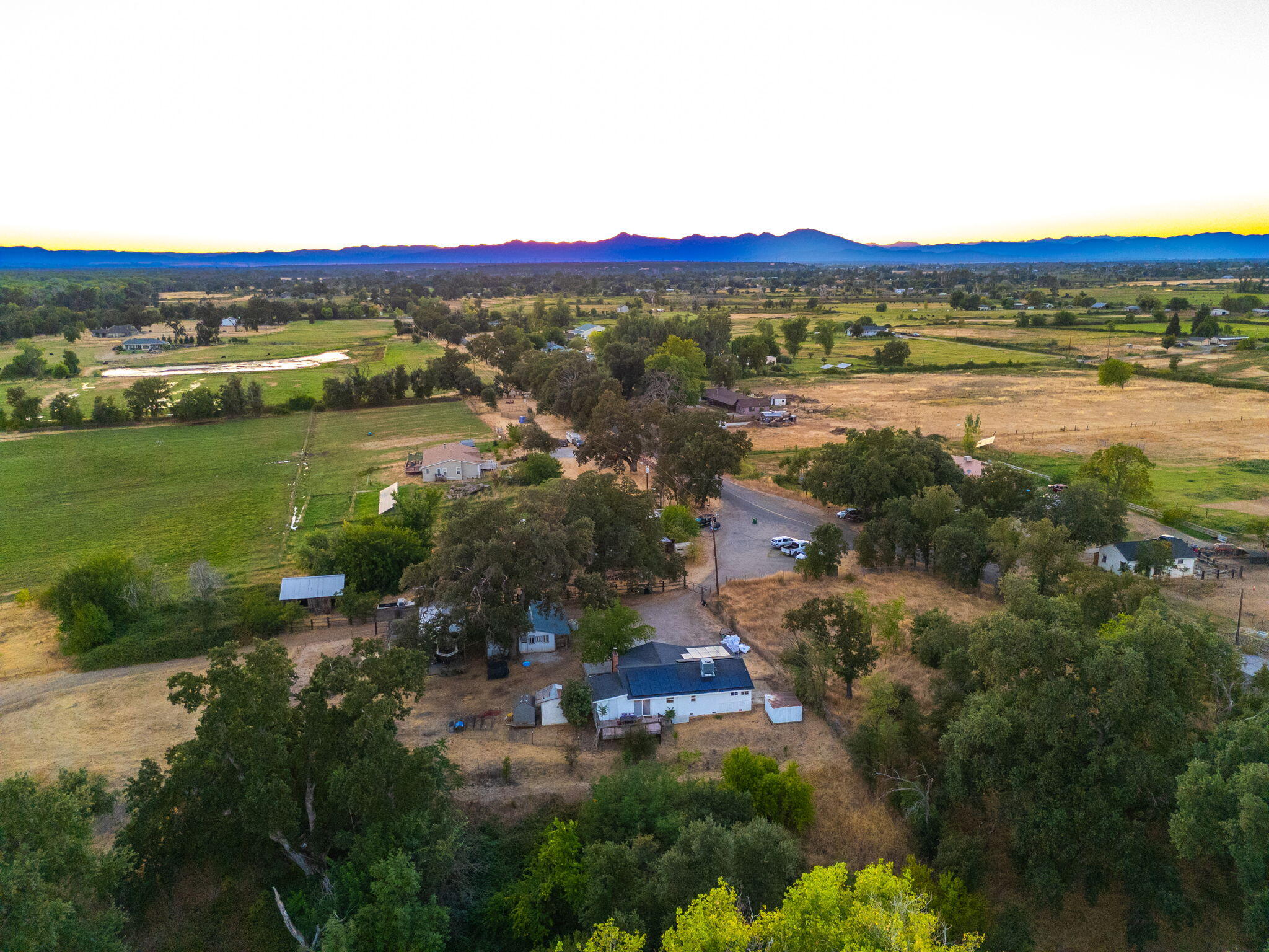 22945 Adobe Road Cottonwood, CA 96022 - Photo 27 of 40 a view of a city with mountains in the background