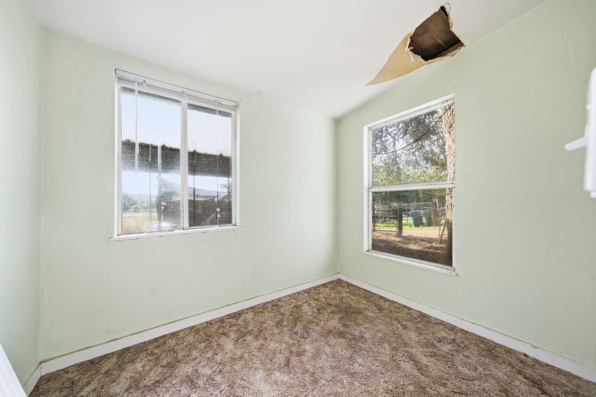 22945 Adobe Road Cottonwood, CA 96022 - Photo 33 of 40 a view of an empty room with a window