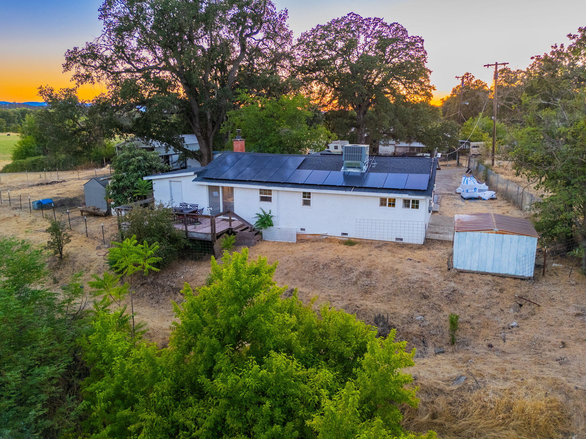 22945 Adobe Road Cottonwood, CA 96022 - Photo 7 of 40 a view of house with yard and trees in the background
