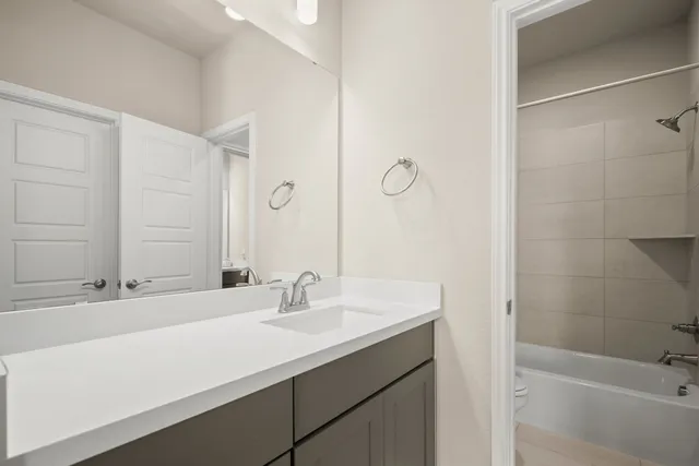 a bathroom with a sink and a bathtub