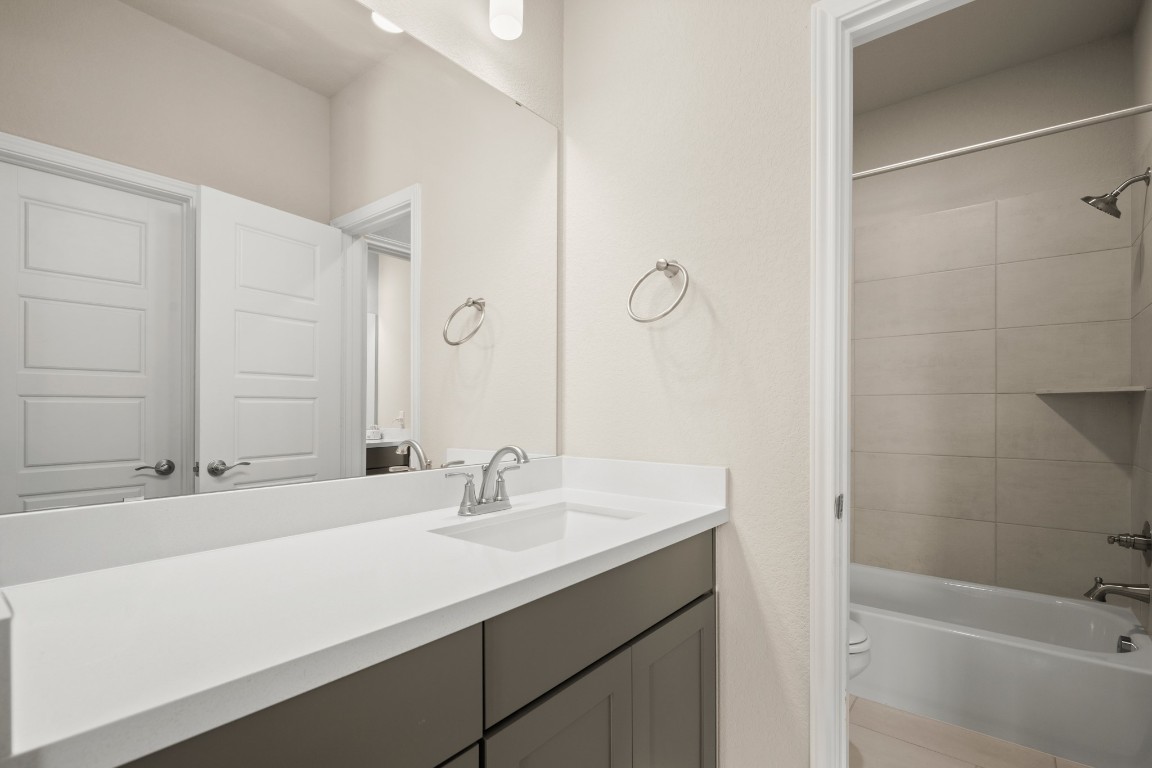 108 Rosetta Loop Liberty Hill, TX 78642 - Photo 26 of 40 a bathroom with a sink and a bathtub