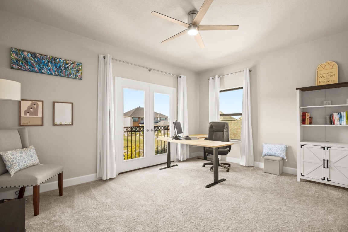 108 Rosetta Loop Liberty Hill, TX 78642 - Photo 27 of 40 a view of a livingroom with workspace and a window