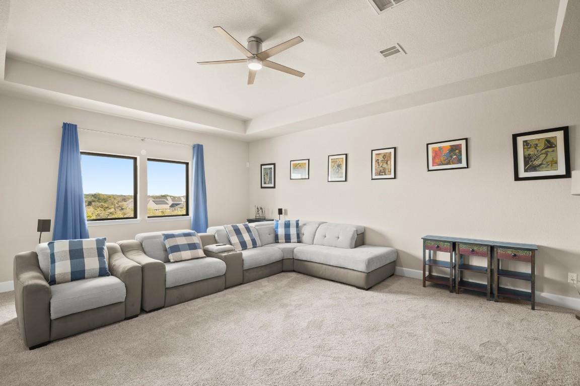 108 Rosetta Loop Liberty Hill, TX 78642 - Photo 32 of 40 a living room with furniture and a large window