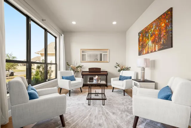 a living room with furniture and a large window