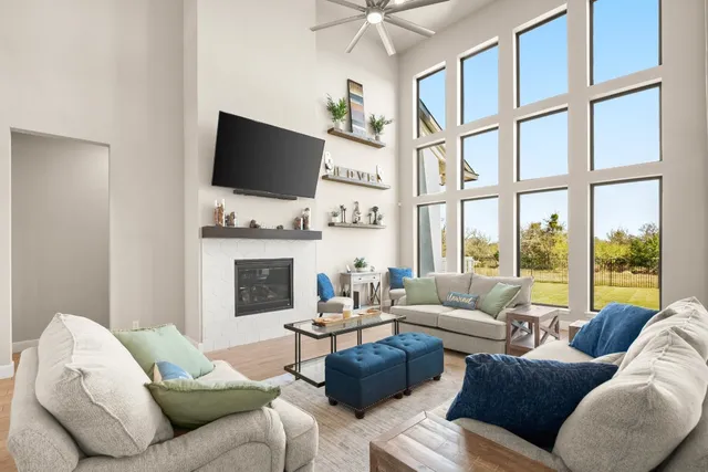 a living room with fireplace furniture and a flat screen tv