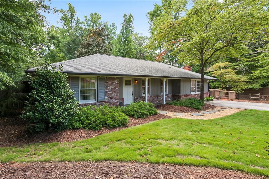 4000 Lower Roswell Road Marietta, GA 30068 - Photo 2 of 25 a front view of a house with yard and green space