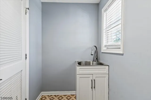 a room with a sink and a window
