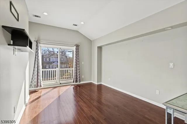 a view of livingroom with wooden floor and sliding door