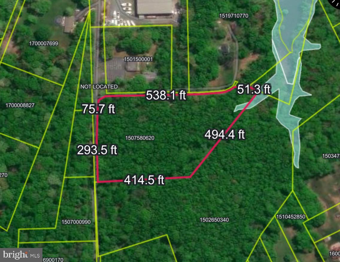 943 Browns Road Essex, MD 21221 - Photo 2 of 8 a sign that is sitting on a green field with plants