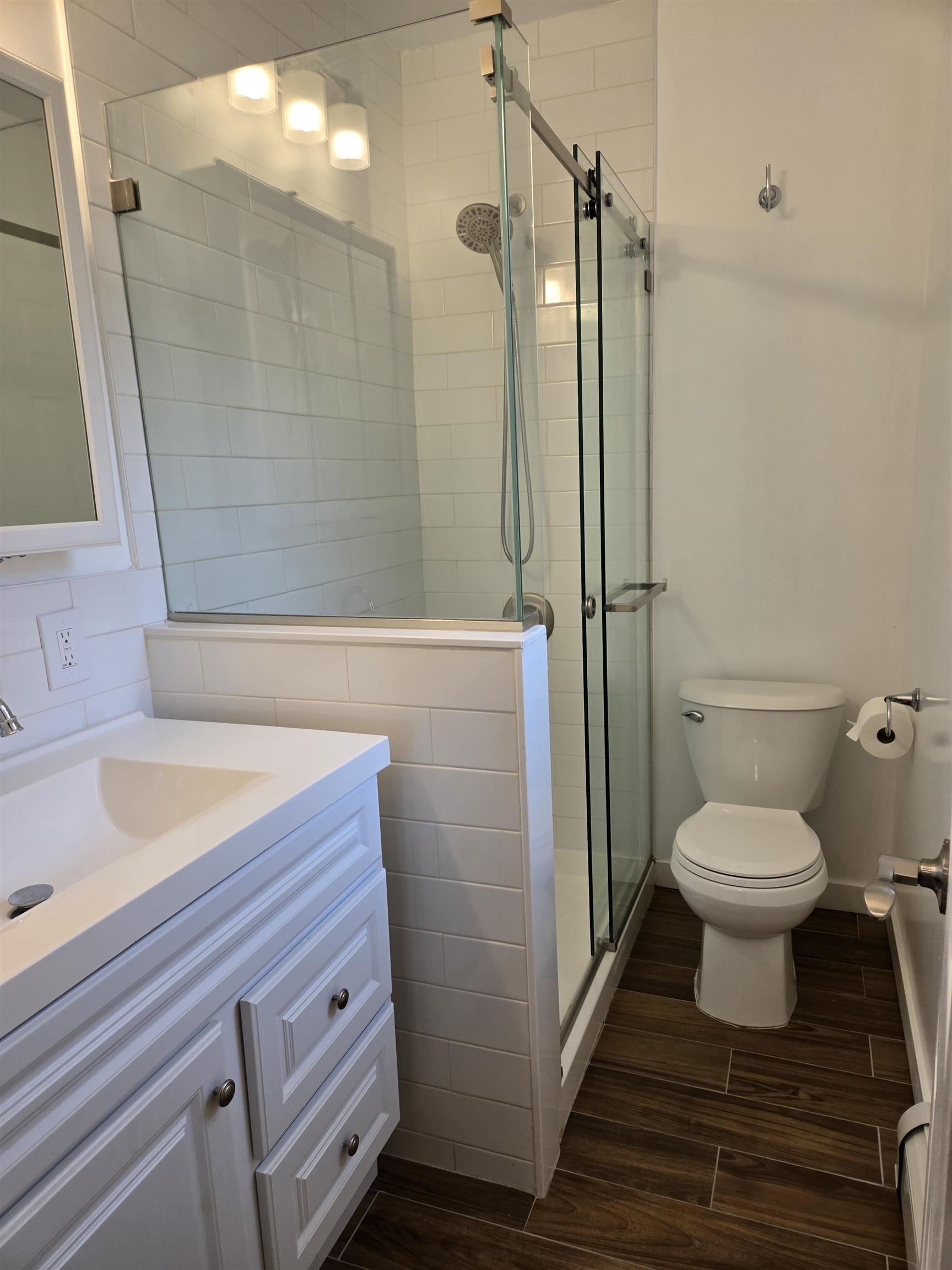 120 68th Street, Unit 1 Guttenberg, NJ 07093 - Photo 7 of 7 a bathroom with a sink a toilet and shower