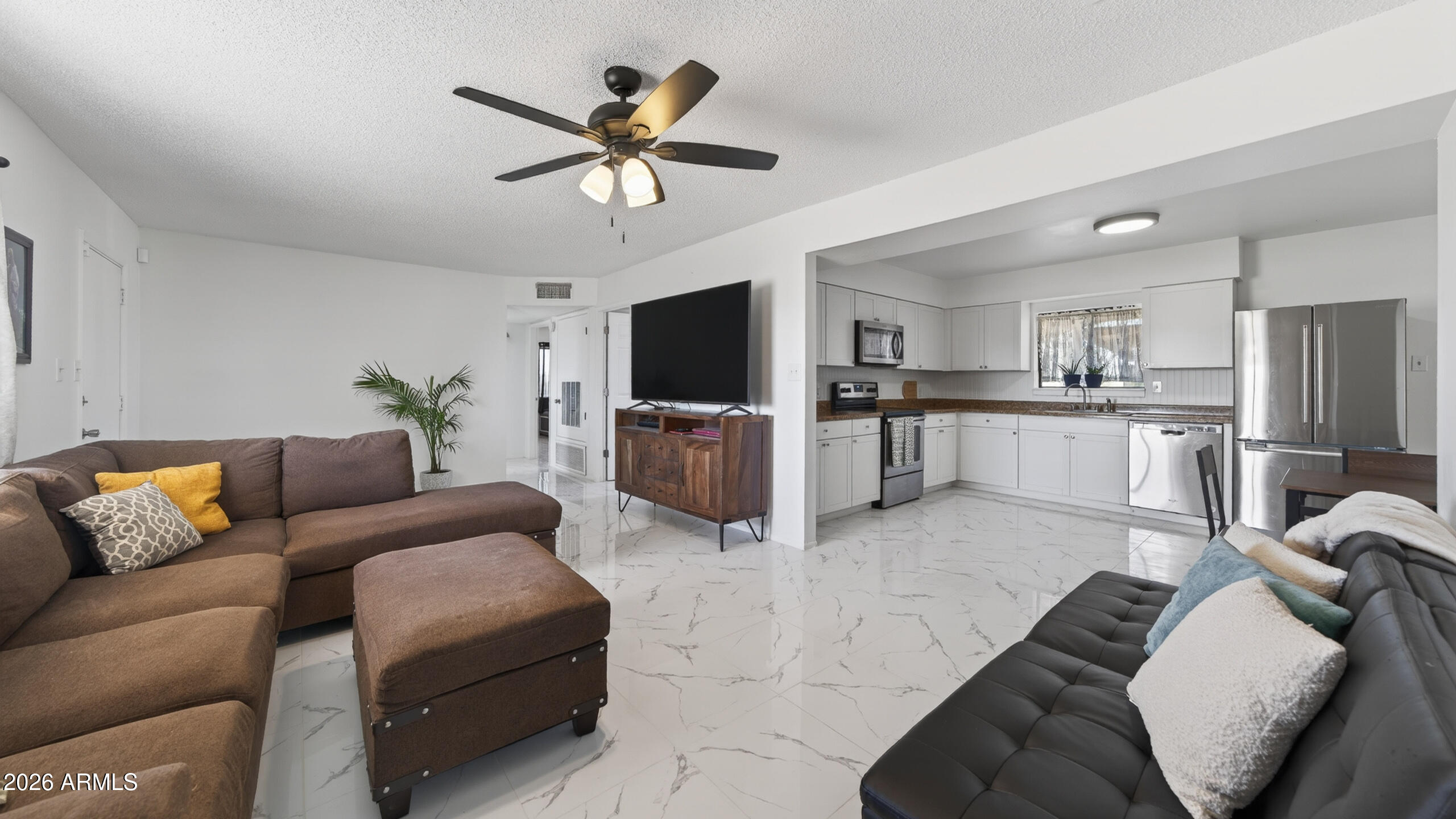 3787 North Joe Hines Road Willcox, AZ 85643 - Photo 1 of 56 a living room with furniture and a flat screen tv