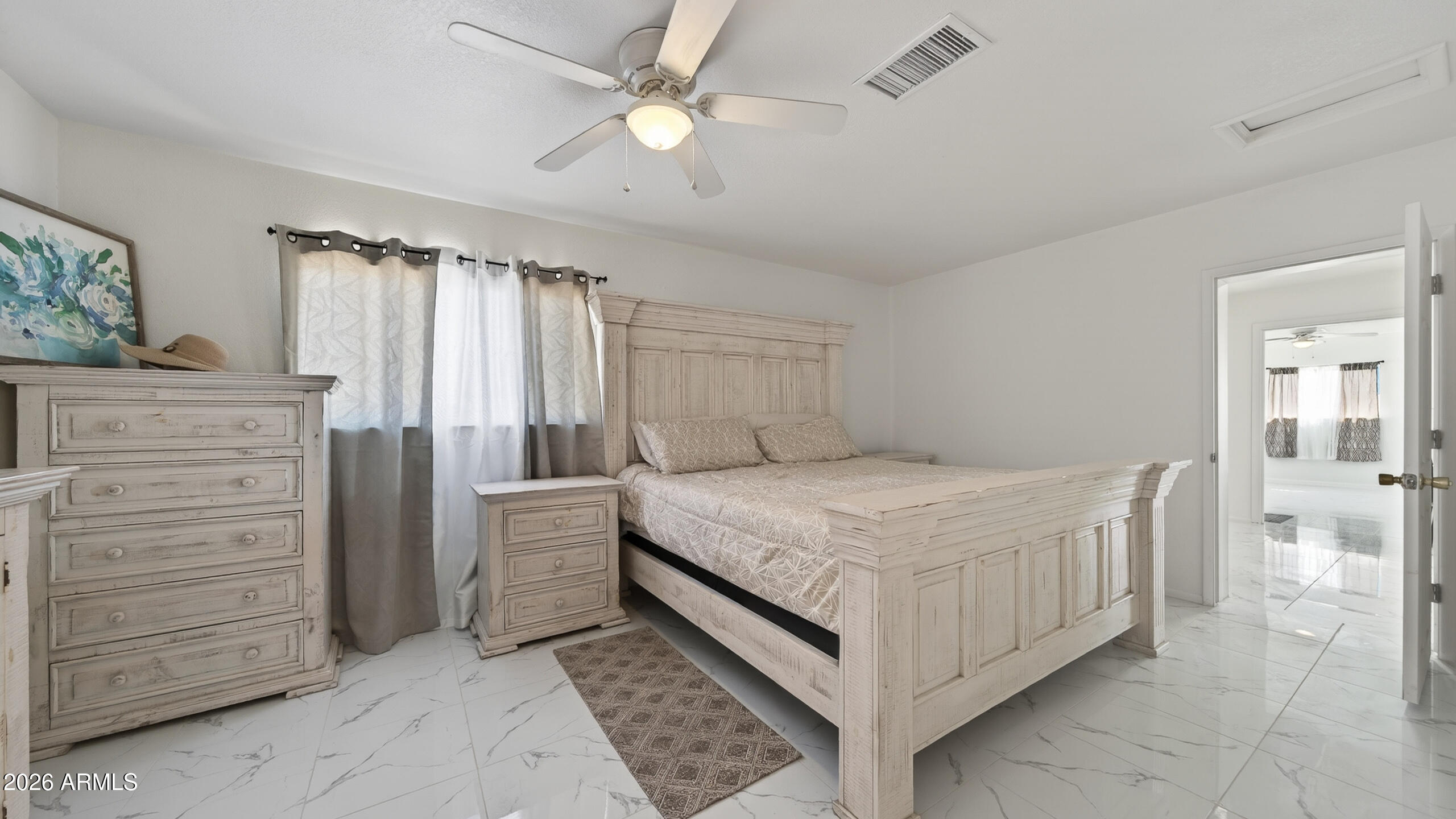3787 North Joe Hines Road Willcox, AZ 85643 - Photo 23 of 56 a bedroom with a bed and a dresser