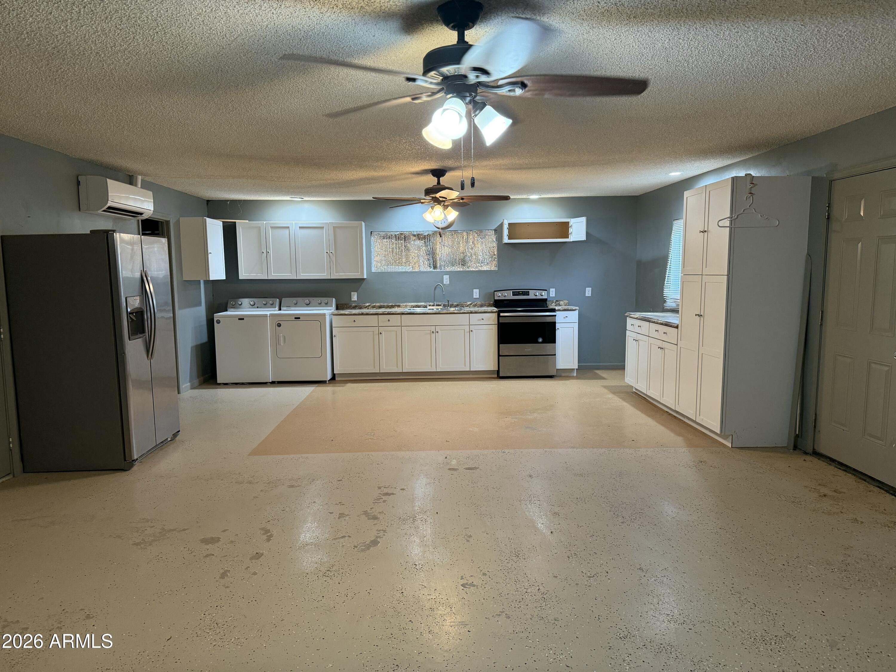 3787 North Joe Hines Road Willcox, AZ 85643 - Photo 40 of 56 a large kitchen with cabinets and stainless steel appliances