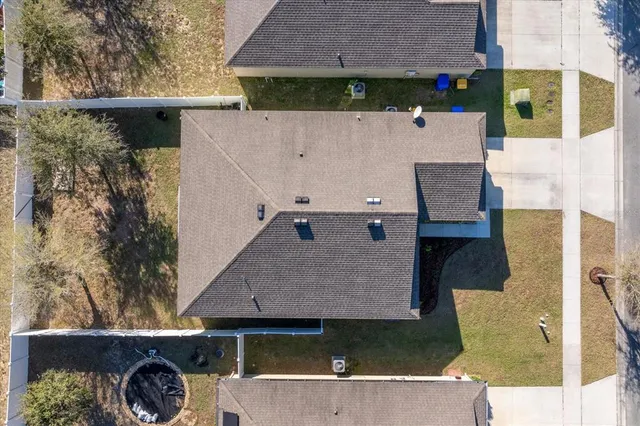 an aerial view of a house with a garden