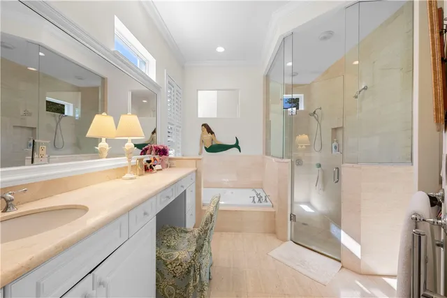 a spacious bathroom with a double vanity sink mirror and shower