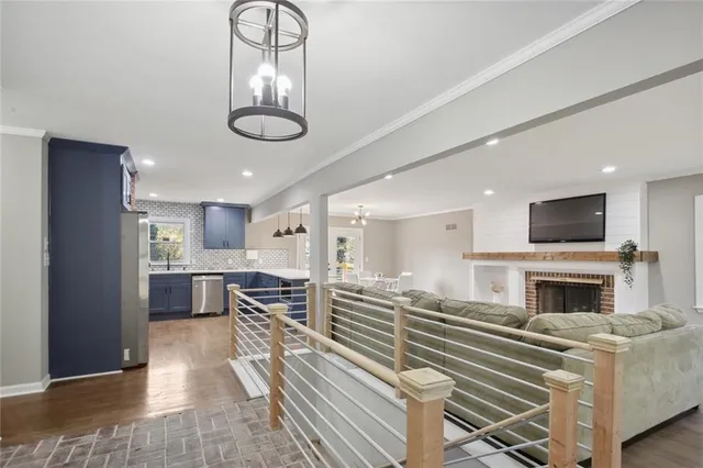 a living room with furniture fireplace and flat screen tv