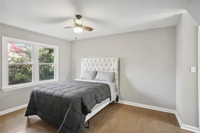 a bedroom with a bed and window