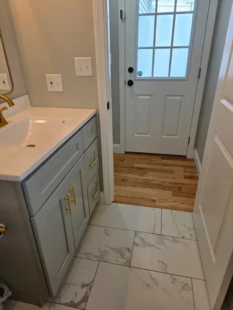 a bathroom with a sink and a mirror