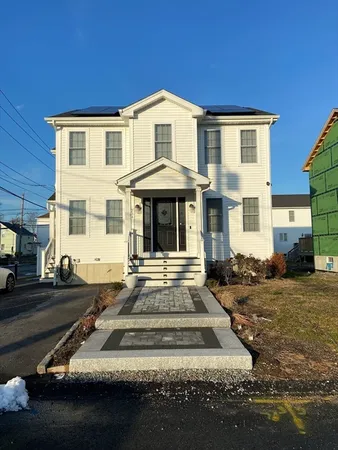 a front view of a house with yard